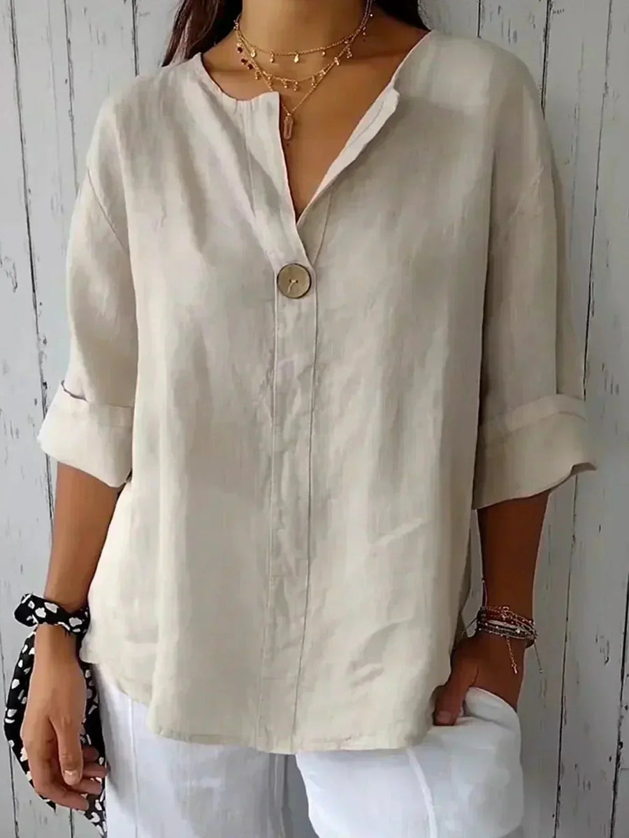 Relaxed V-neck top by THE WHITMORE FAMILY featuring a comfortable fit and soft fabric in a casual style.