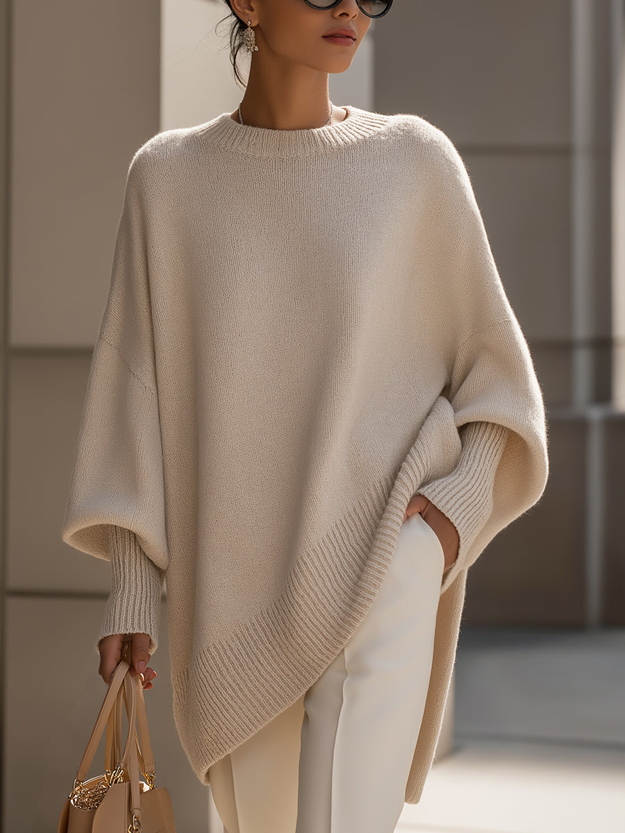 Jennifer oversized long sleeve sweater by THE WHITMORE FAMILY, draped wide-neck design, soft knit fabric in neutral tones.