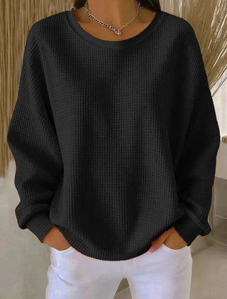 Cream-colored women's classic jumper sweater by THE WHITMORE FAMILY, showing a cozy knit design and round neckline.