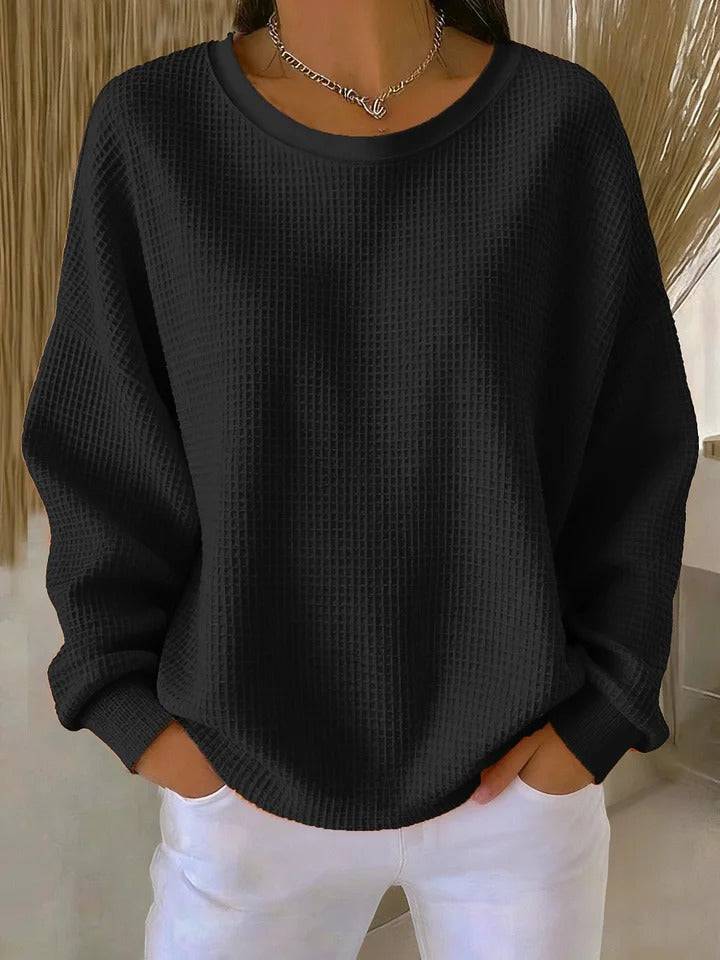 Cream-colored women's classic jumper sweater by THE WHITMORE FAMILY, showing a cozy knit design and round neckline.
