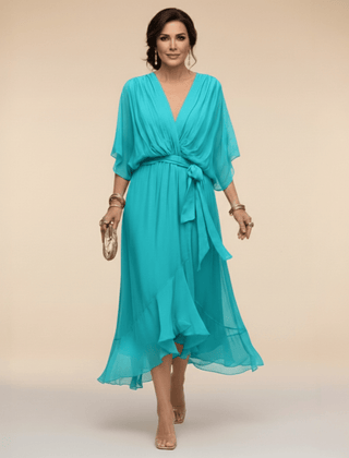 Mona V-neck dress by THE WHITMORE FAMILY, featuring a stylish fit and elegant design in soft fabric.