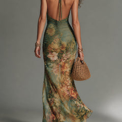 Shea floral maxi dress by THE WHITMORE FAMILY featuring a flowing fabric and vibrant floral print, perfect for summer wear.