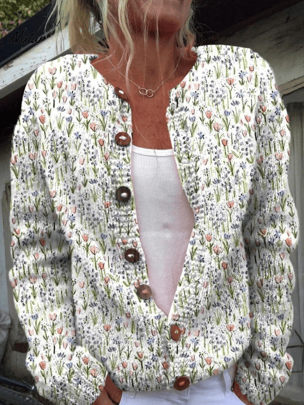 Vintage floral Ivadelle™ cardigan by THE WHITMORE FAMILY featuring a soft knit fabric and floral pattern, shown on a hanger.