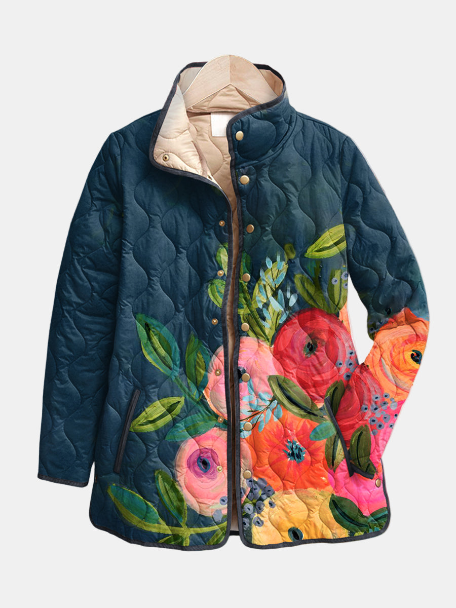 Vintage floral print quilted jacket by THE WHITMORE FAMILY, featuring colorful floral patterns and quilted texture.