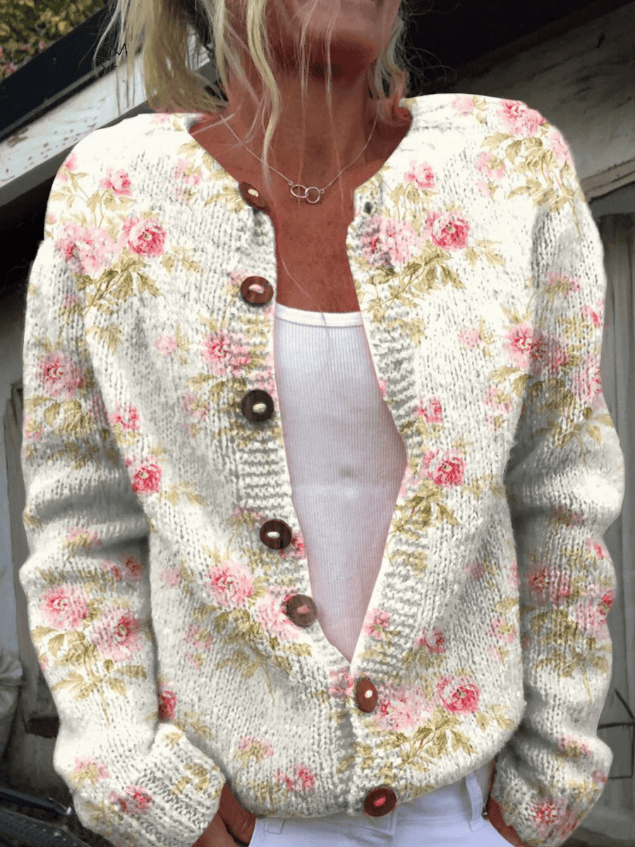 Vintage floral cardigan from THE WHITMORE FAMILY featuring a classic design and soft fabric in a stylish, colorful pattern.