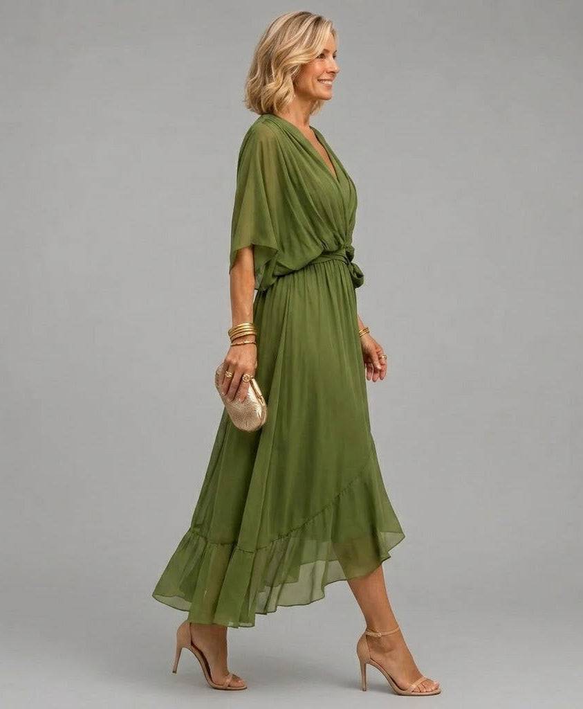 Mona V-neck dress by THE WHITMORE FAMILY, showing a stylish, flowy dress with a V-neckline and elegant design.