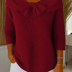 Women's sweater by THE WHITMORE FAMILY featuring a bow detail and round neckline, made of soft knit fabric.