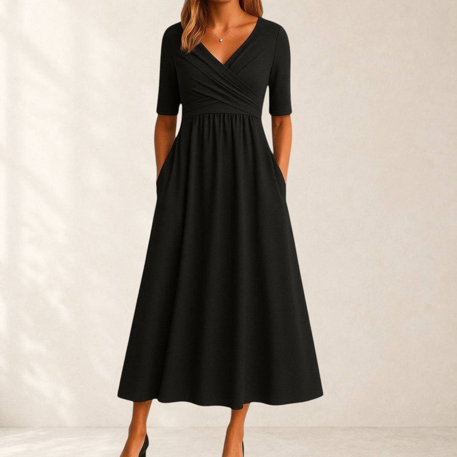 Elegant Phoebe midi dress by THE WHITMORE FAMILY, shown in a stylish, flowing design perfect for formal occasions.