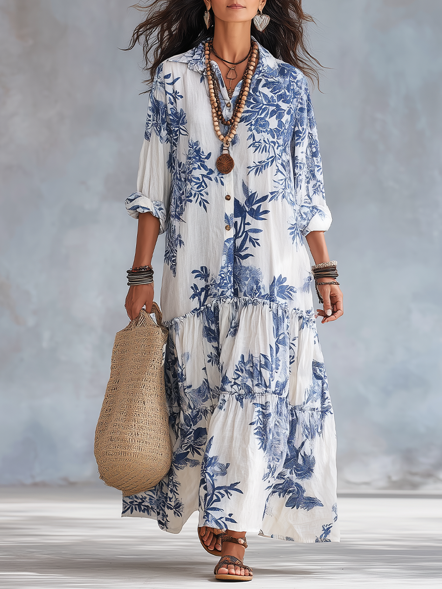Dahlia™ Bohemian Blue Floral Button-Down Tiered Maxi Dress by THE WHITMORE FAMILY, featuring a flowing tiered design and floral pattern.