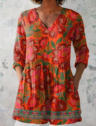 Marion long blouse with V-neck by THE WHITMORE FAMILY, featuring lightweight fabric and a relaxed fit, displayed on a hanger.