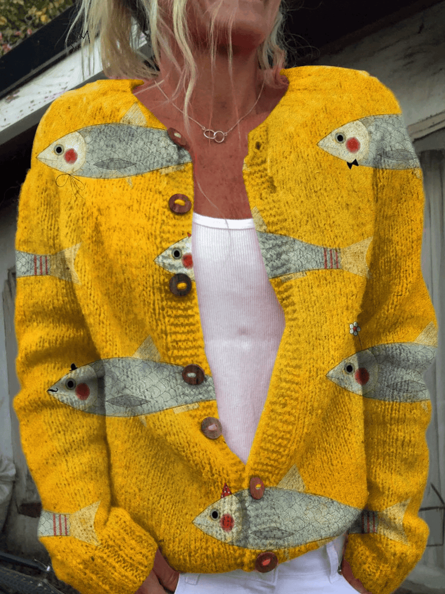 Vintage Anouk™ cardigan sweater by THE WHITMORE FAMILY, soft knit with classic design and button-up front, displayed on a hanger.