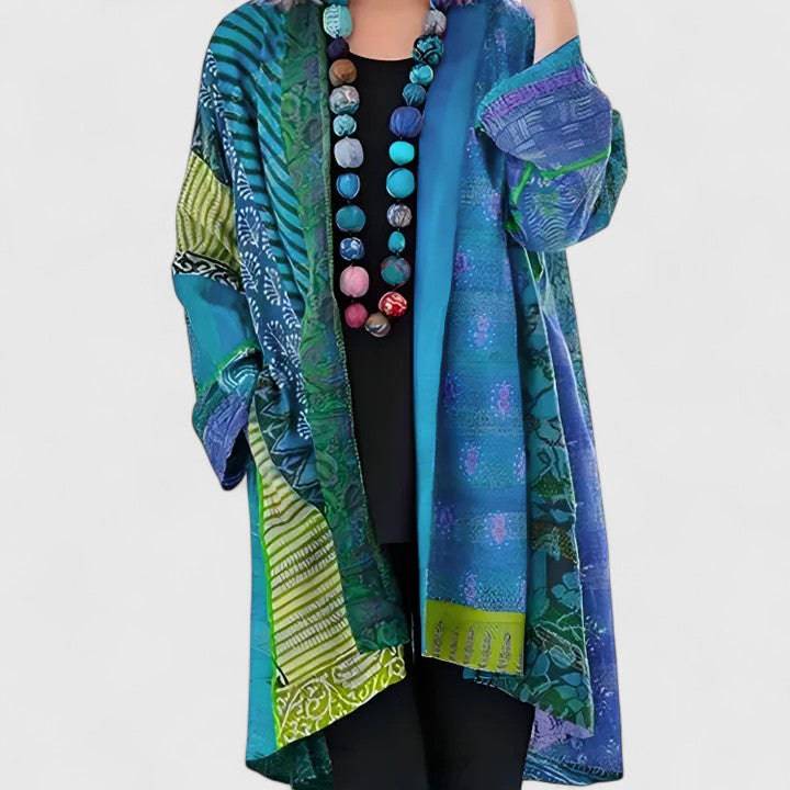 Elegant Calirenne sweater by THE WHITMORE FAMILY, featuring a stylish cardigan with a soft knit fabric and classic design.
