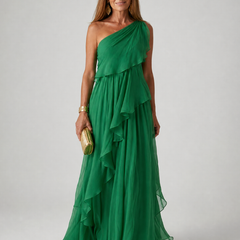 Elegant Talia cascading ruffle maxi dress by THE WHITMORE FAMILY featuring flowing fabric and layered ruffle details.