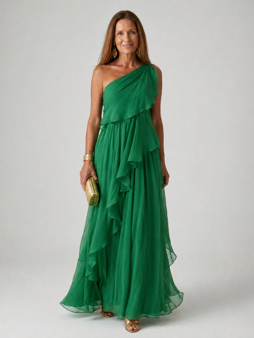 Elegant Talia cascading ruffle maxi dress by THE WHITMORE FAMILY featuring flowing fabric and layered ruffle details.