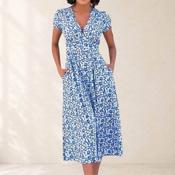 Roseanna comfortable midi dress by THE WHITMORE FAMILY, featuring a flowy fabric and elegant design, shown on a model.