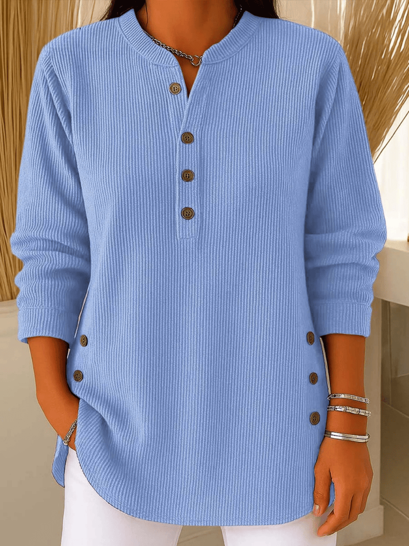 Neva™ Button Henley Tunic from THE WHITMORE FAMILY, featuring a casual fit, button-front neckline, and long sleeves.