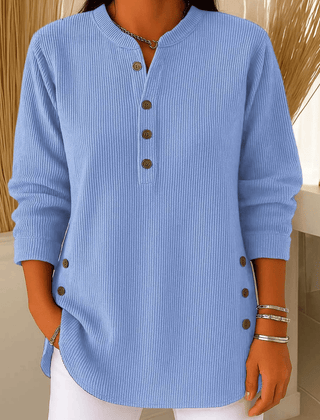 Button Henley sweater tunic for women by THE WHITMORE FAMILY, featuring a classic henley neckline and button details in cozy knit fabric.