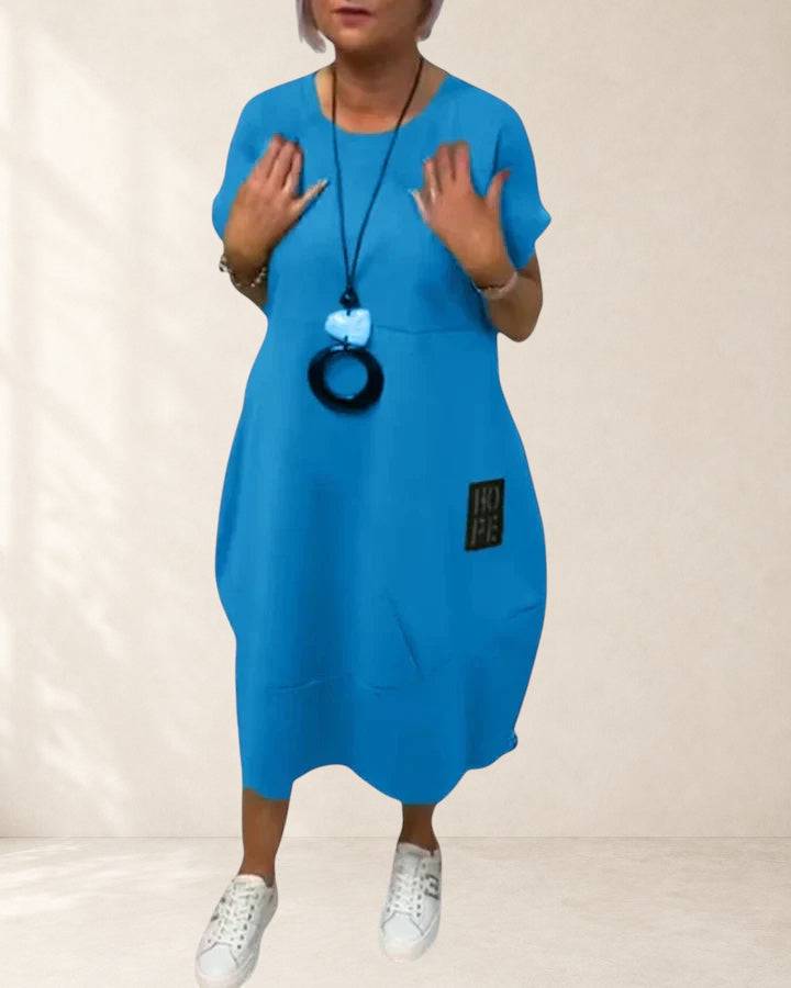 Thalyssiah comfortable midi dress by THE WHITMORE FAMILY, shown in a relaxed fit with soft fabric and stylish design.