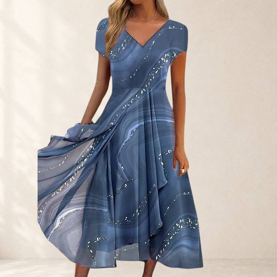 Aubrielle™ flowing midi dress from THE WHITMORE FAMILY featuring lightweight fabric and a relaxed fit, displayed on a hanger.