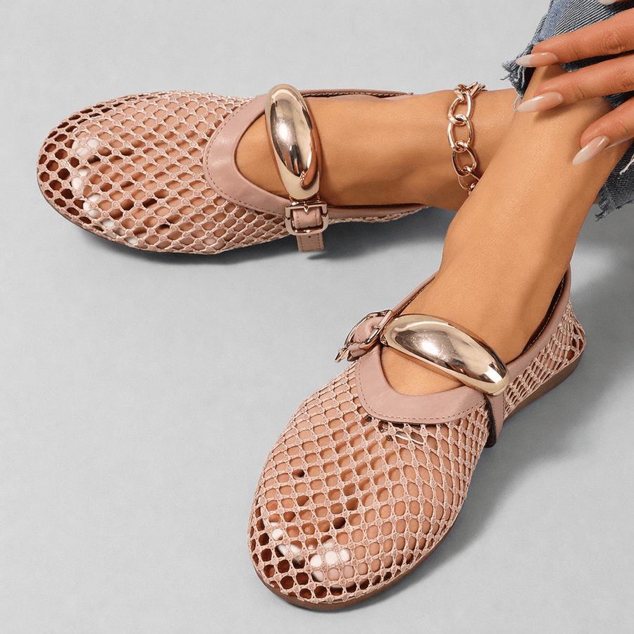 Arlena Mary Jane flats by THE WHITMORE FAMILY with black leather straps and rounded toe, shown on a neutral background.