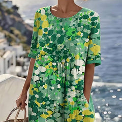 Elegant floral summer midi dress from THE WHITMORE FAMILY labeled ELENA™, featuring a flowy design and vibrant floral pattern.