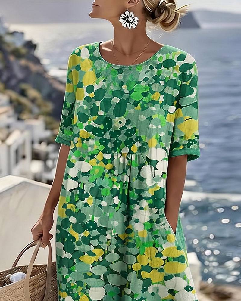 Elegant floral summer midi dress from THE WHITMORE FAMILY labeled ELENA™, featuring a flowy design and vibrant floral pattern.