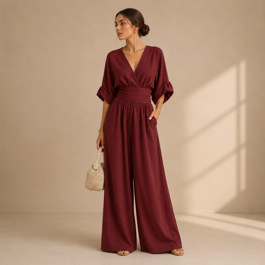 Elegant Isabelle jumpsuit by THE WHITMORE FAMILY displayed on a model, featuring a sleek, tailored design with stylish details.