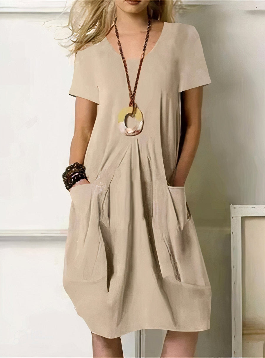 Kwani Easy Casual Flow Dress by THE WHITMORE FAMILY, shown in a relaxed, flowing design, perfect for casual wear.