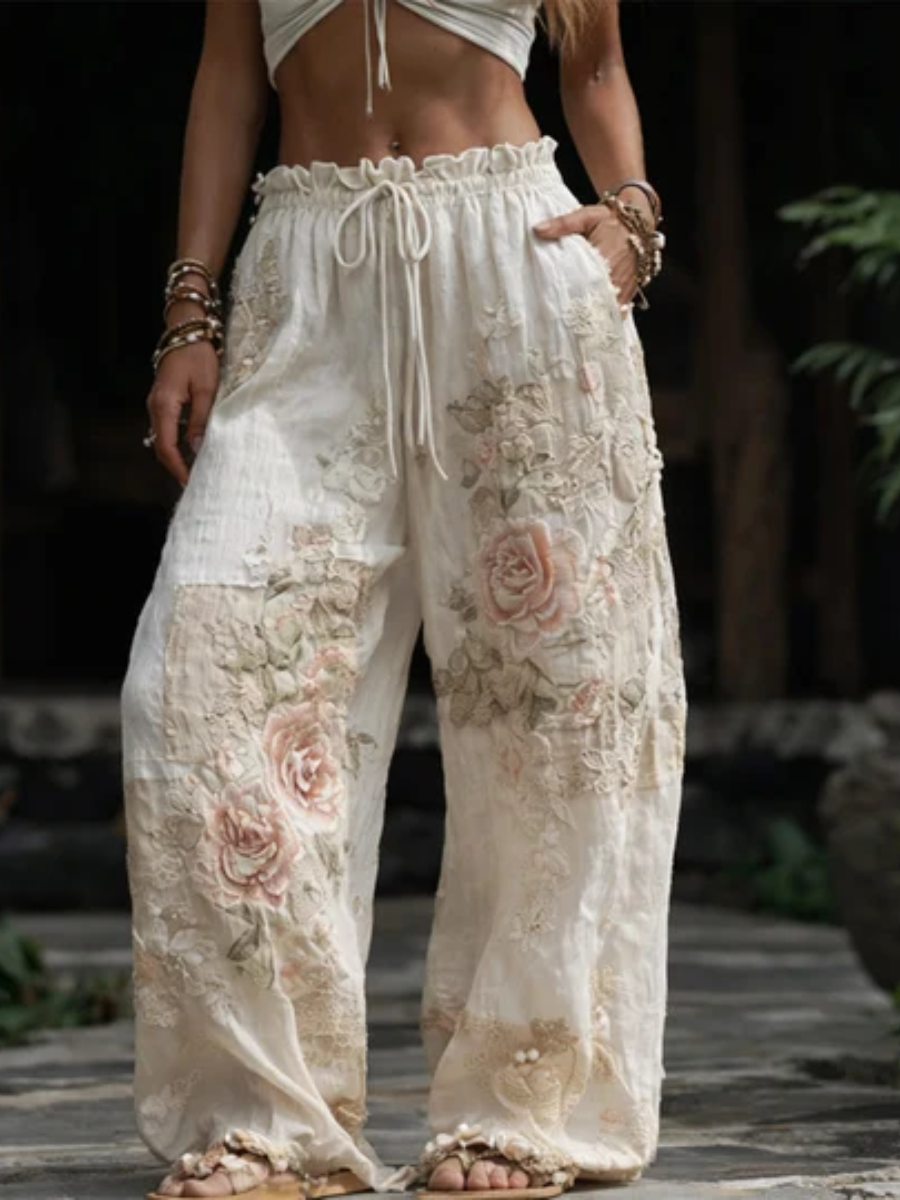 Denae™ embroidered wide-leg pants by THE WHITMORE FAMILY featuring relaxed fit and intricate embroidery details.
