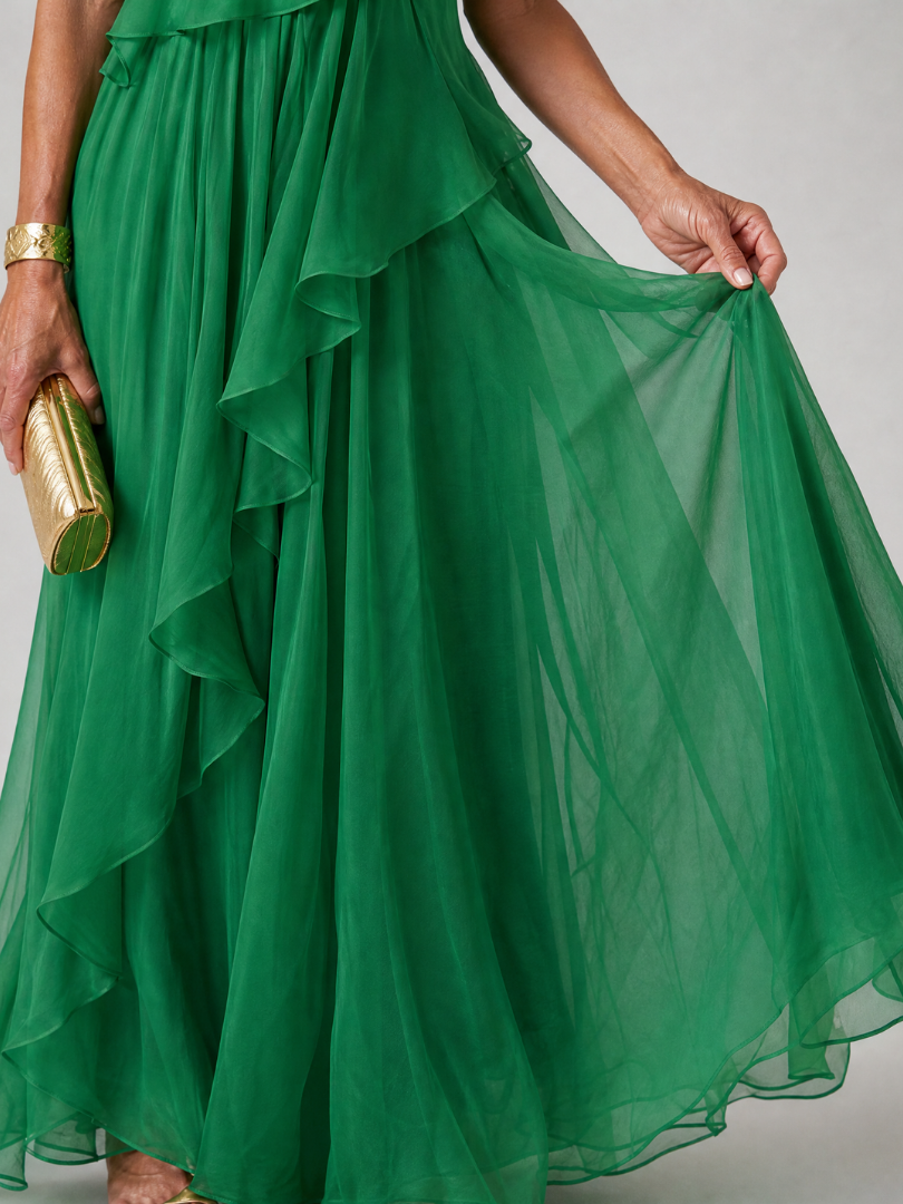 Talia cascading ruffle maxi dress by THE WHITMORE FAMILY, flowing fabric with layered ruffles and elegant design.