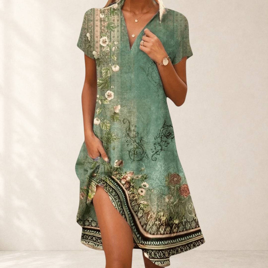 Elegant black Firi Chic Elegant Dress by THE WHITMORE FAMILY displayed on a hanger with detailed fabric texture