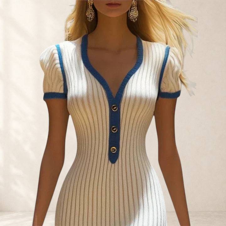 Elegant midi dress by THE WHITMORE FAMILY with a fitted bodice and flowing skirt, showcased in a natural pose.