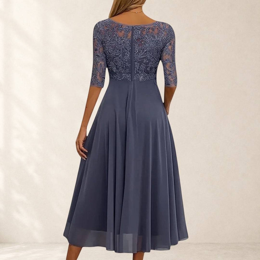 Elegant lace dress named Rhonda by THE WHITMORE FAMILY, featuring delicate lace fabric and a stylish, sophisticated design.