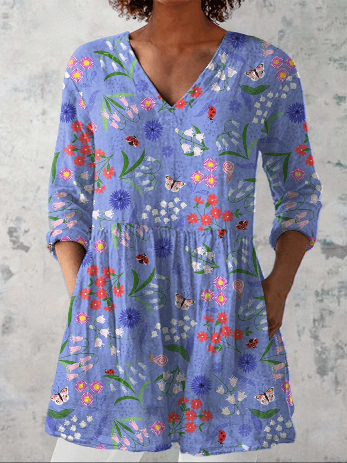 Aline long blouse with V-neck in soft fabric, featuring a relaxed fit and subtle detailing, from THE WHITMORE FAMILY.