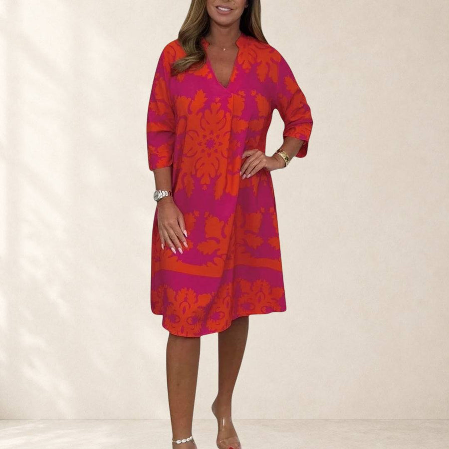 Daisy spring dress by THE WHITMORE FAMILY featuring a floral pattern, lightweight fabric, and elegant design for warm weather.