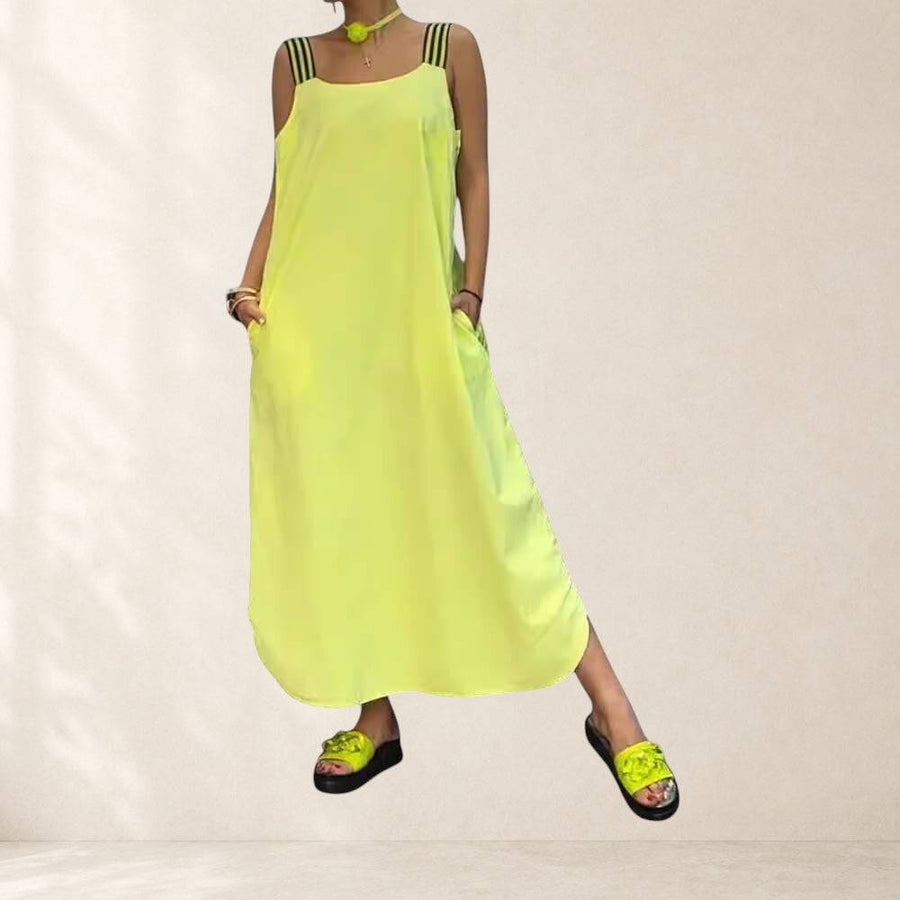 Faith summer dress by THE WHITMORE FAMILY, featuring a lightweight, flowy fabric with floral patterns and sleeveless design.