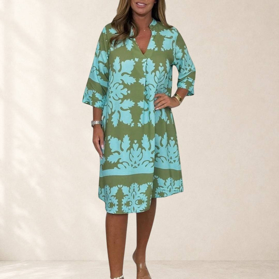 Elegant spring dress named Daisy by THE WHITMORE FAMILY, featuring floral patterns and a flowing silhouette.
