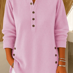 Cream-colored button Henley sweater tunic for women by THE WHITMORE FAMILY, featuring a ribbed collar and long sleeves.