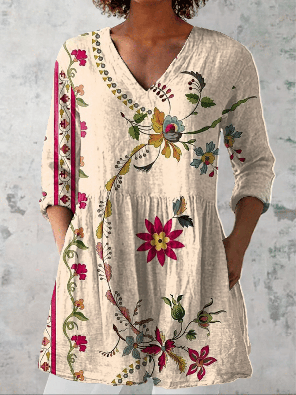 Clara long blouse with V-neck from THE WHITMORE FAMILY, featuring a flowing fabric and elegant design.