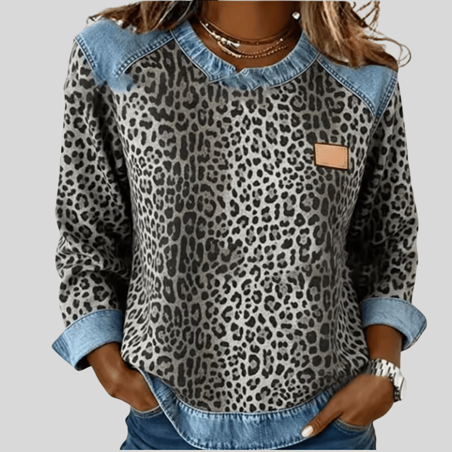 Hollyn™ leopard print sweater with denim collar by THE WHITMORE FAMILY, featuring a stylish animal print and casual denim accents.