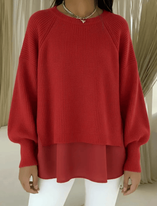 Layered-look women's sweater by THE WHITMORE FAMILY, featuring a stylish multi-layered design and cozy knit fabric.