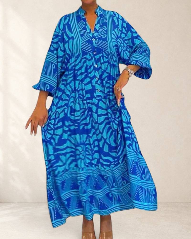 Mckinley™ maxi dress with elegant floral print, flowing fabric, and sleeveless design for a stylish summer look.