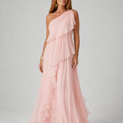 Talia cascading ruffle maxi dress by THE WHITMORE FAMILY, flowing fabric with layered ruffles and a floor-length silhouette.