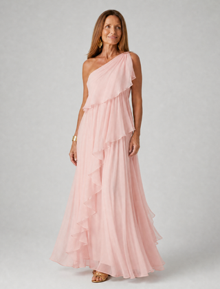 Talia cascading ruffle maxi dress by THE WHITMORE FAMILY, flowing fabric with layered ruffles and a floor-length silhouette.