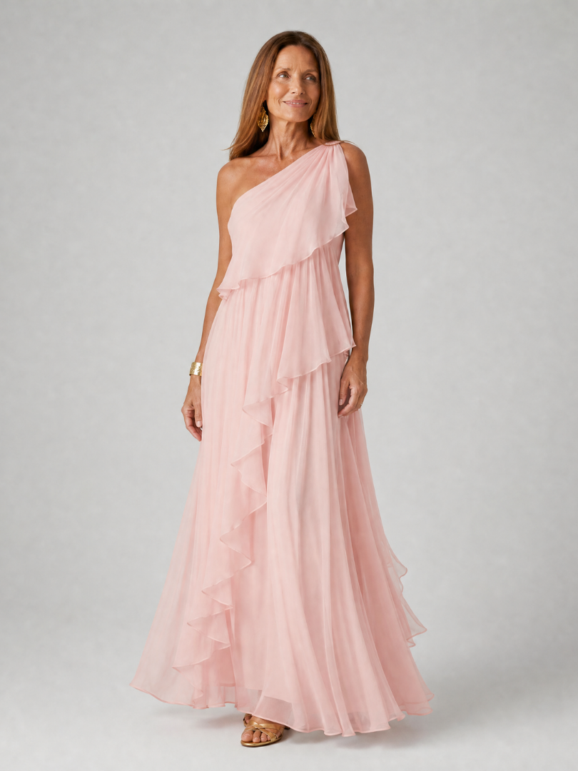 Talia cascading ruffle maxi dress by THE WHITMORE FAMILY, flowing fabric with layered ruffles and a floor-length silhouette.