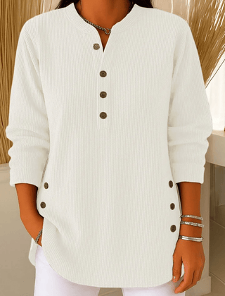 Button Henley tunic sweater for women by THE WHITMORE FAMILY featuring a casual, comfortable design with a buttoned neckline.