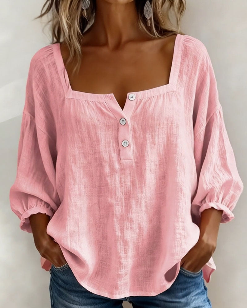 Gertrude elegant lantern sleeve blouse by THE WHITMORE FAMILY, featuring flowy fabric and detailed lantern sleeves.