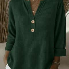 Women’s Henley button sweater by THE WHITMORE FAMILY featuring a cozy knit fabric and classic button-up design.