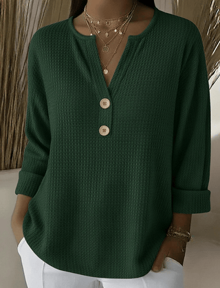 Women’s Henley button sweater by THE WHITMORE FAMILY featuring a cozy knit fabric and classic button-up design.