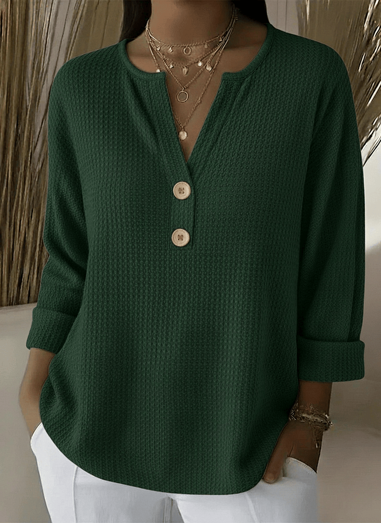 Women’s Henley button sweater by THE WHITMORE FAMILY featuring a cozy knit fabric and classic button-up design.